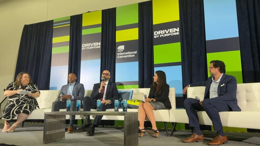 Panel discussion at Bio International Convention with diverse speakers.