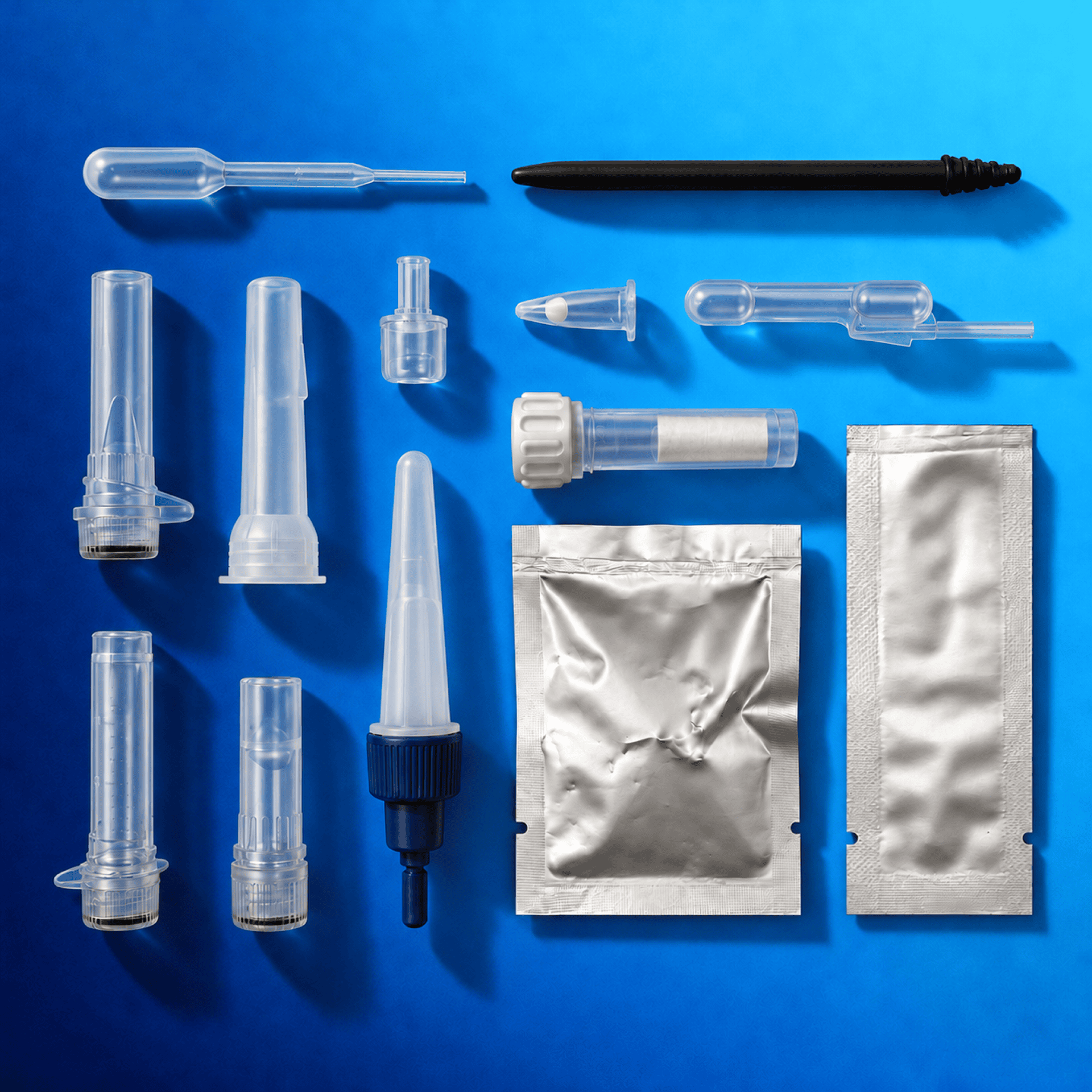 Medical lab accessories and diagnostic components on blue background.